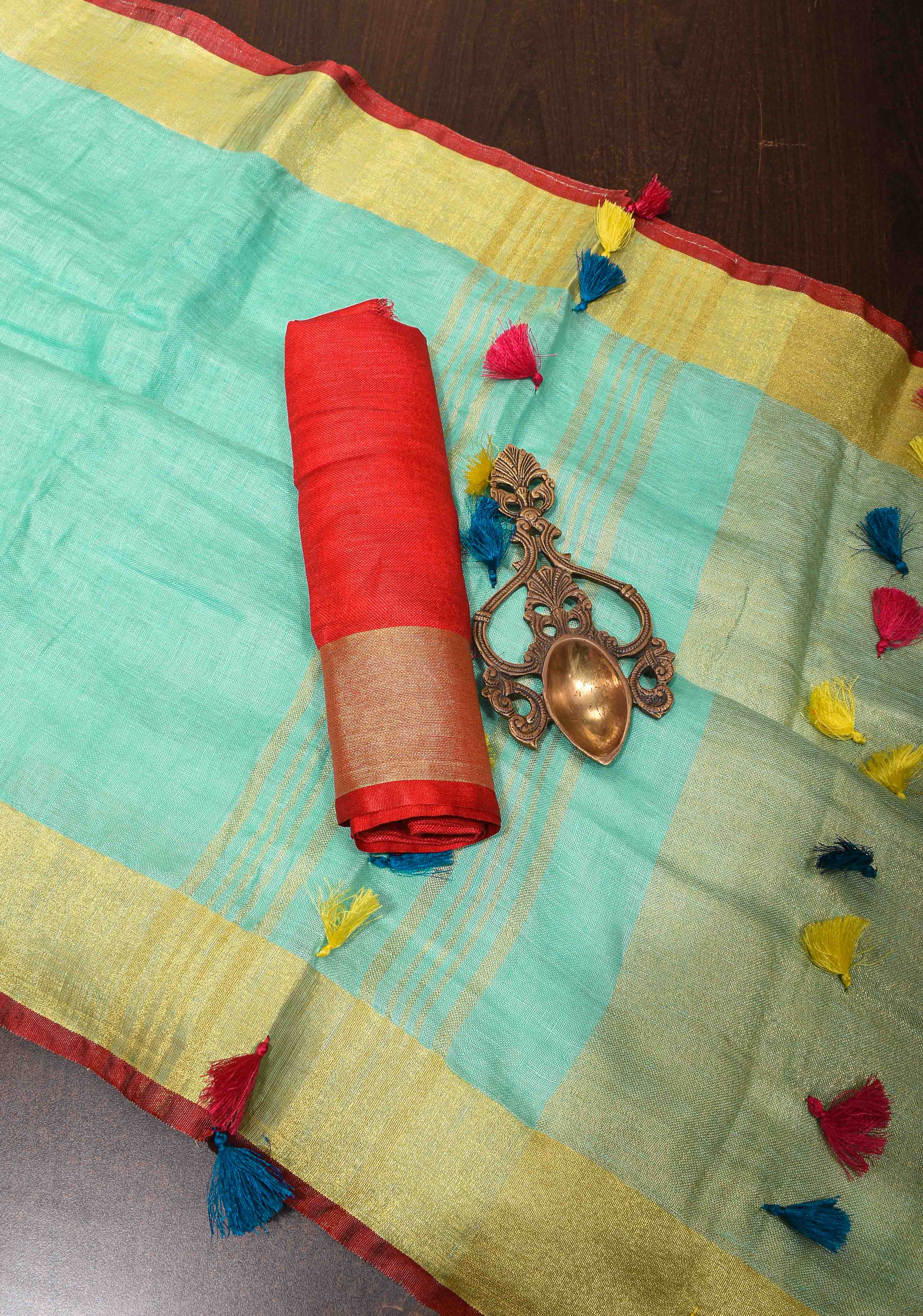 Seafoam Green Linen By  Linen Saree with Zari Border and Multicolor Tassels on Pallu | Shobitam