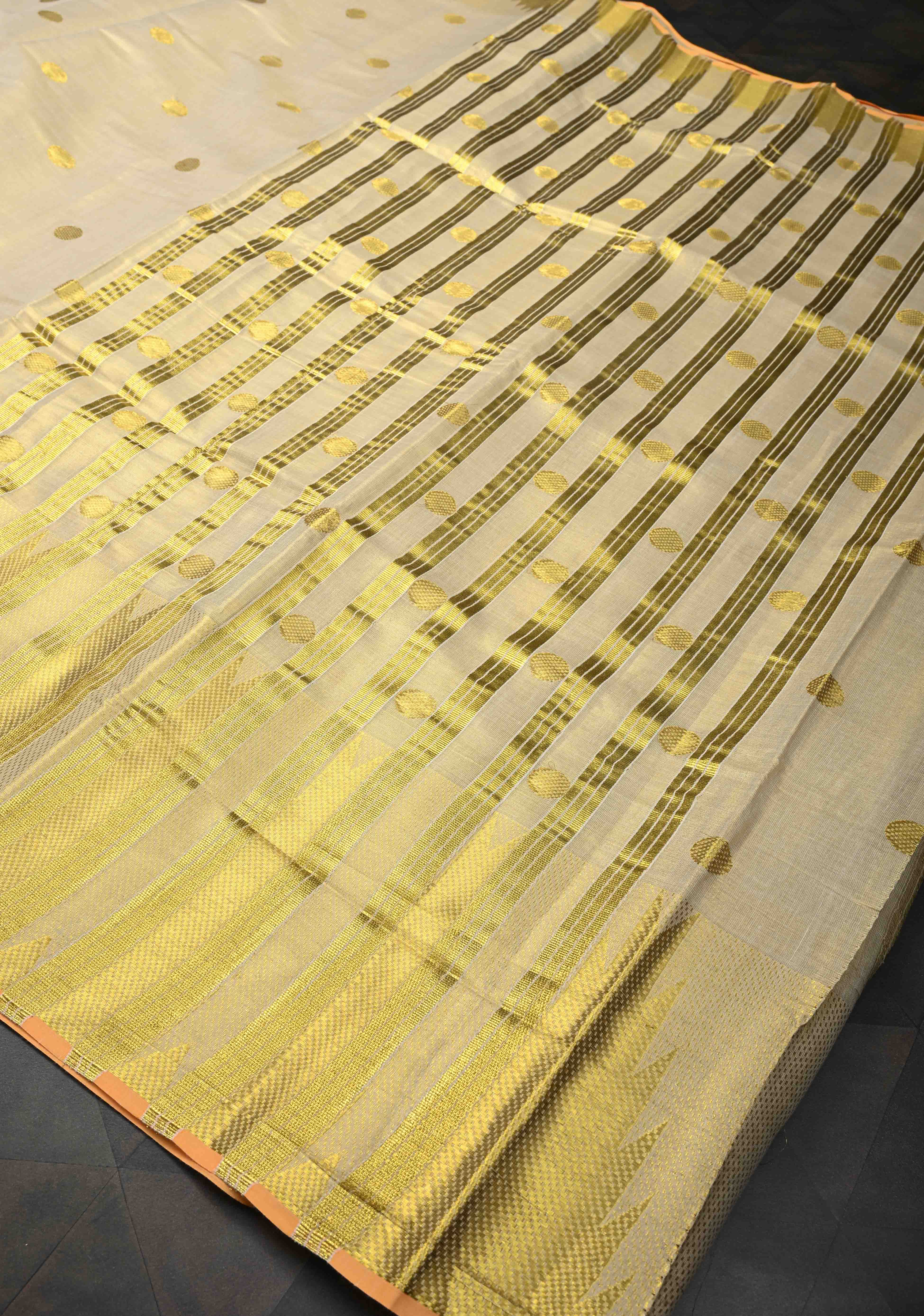 Beige Tissue Cotton Saree with Zari Coin Buttis And Temple Border | Shobitam
