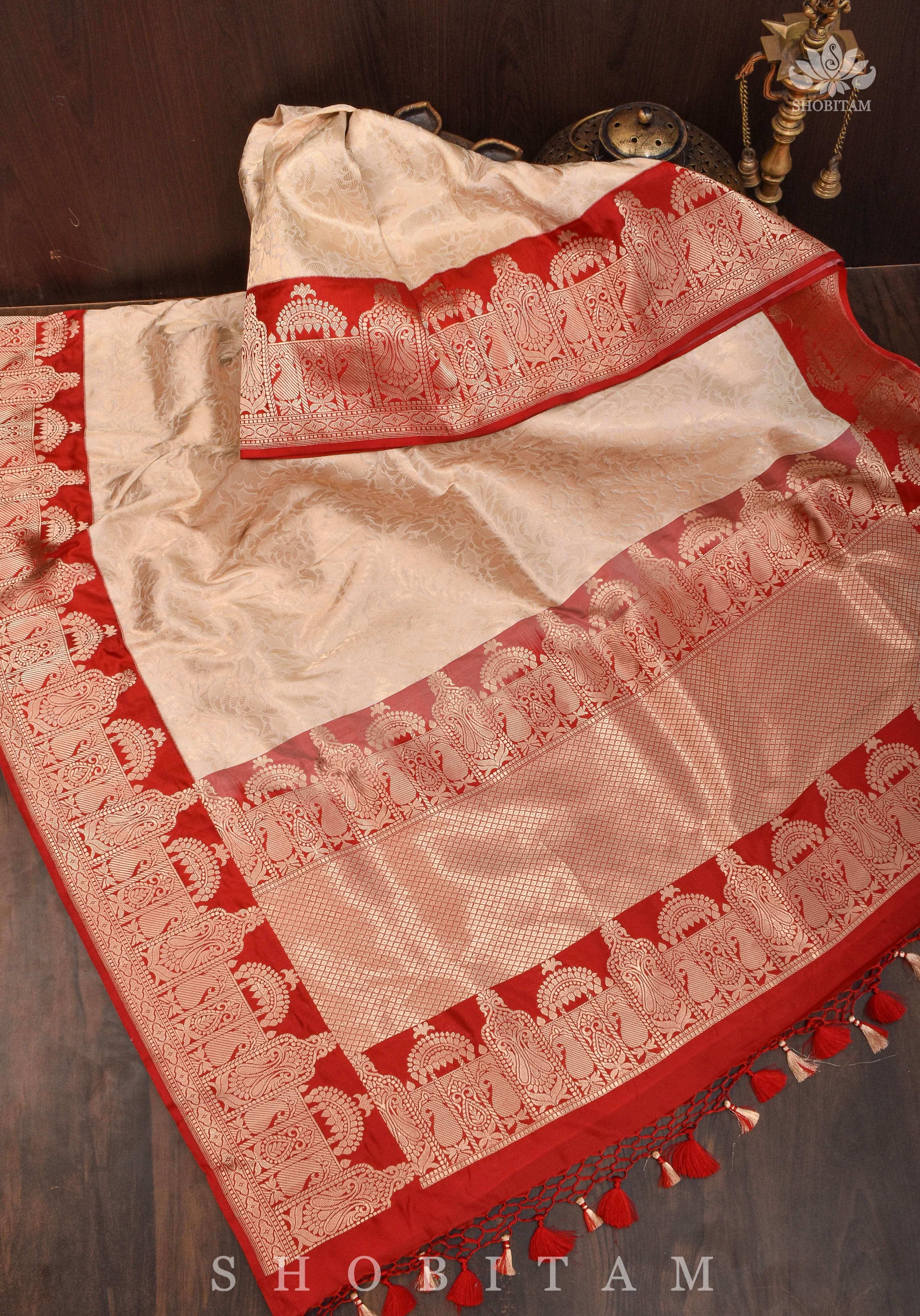 Exquisite Celebrity Brocade Banarasi Pure Katan Silk Saree in Ivory, Red & Gold with Dome Shaped Kadhiyal Borders, Grand Pallu and Zari | SILK MARK CERTIFIED