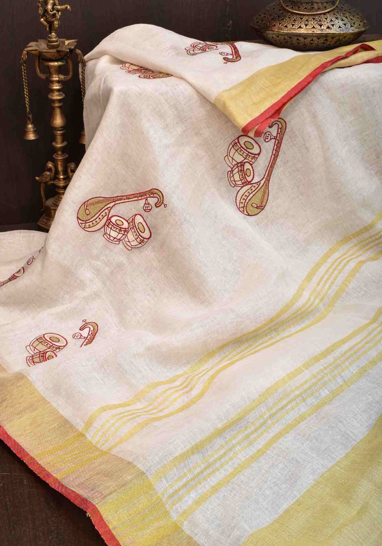 Linen by Linen Saree in White with Musical instruments embroidery motifs