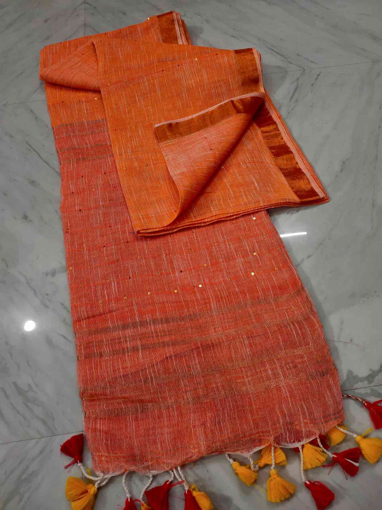 Sunset Toned cotton Linen interwoven sequins with tassels in pallu Pre Pleated Saree