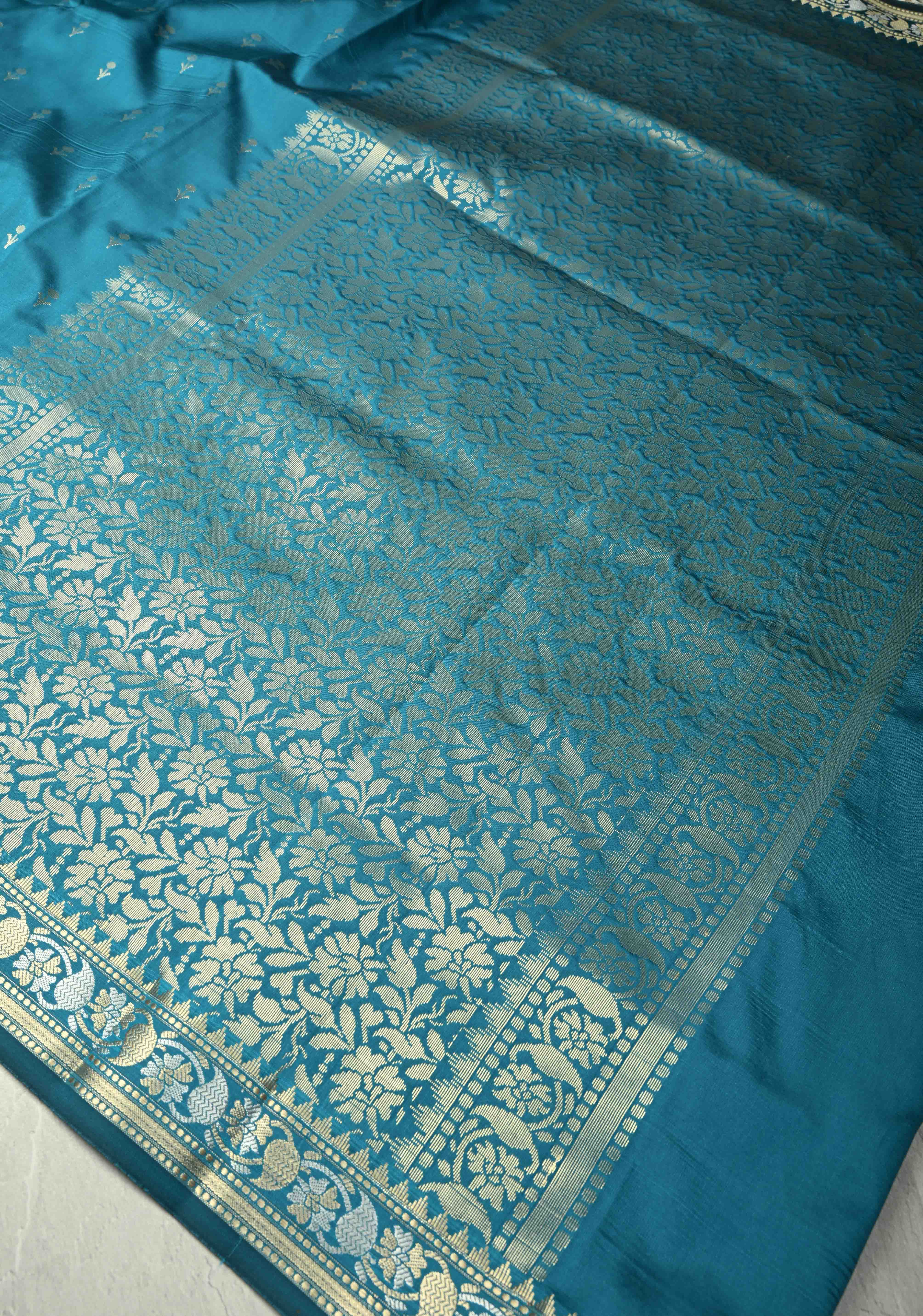 Peacock Blue Semi Silk Saree with Floral Buttis and Alfi Zari Border | Shobitam