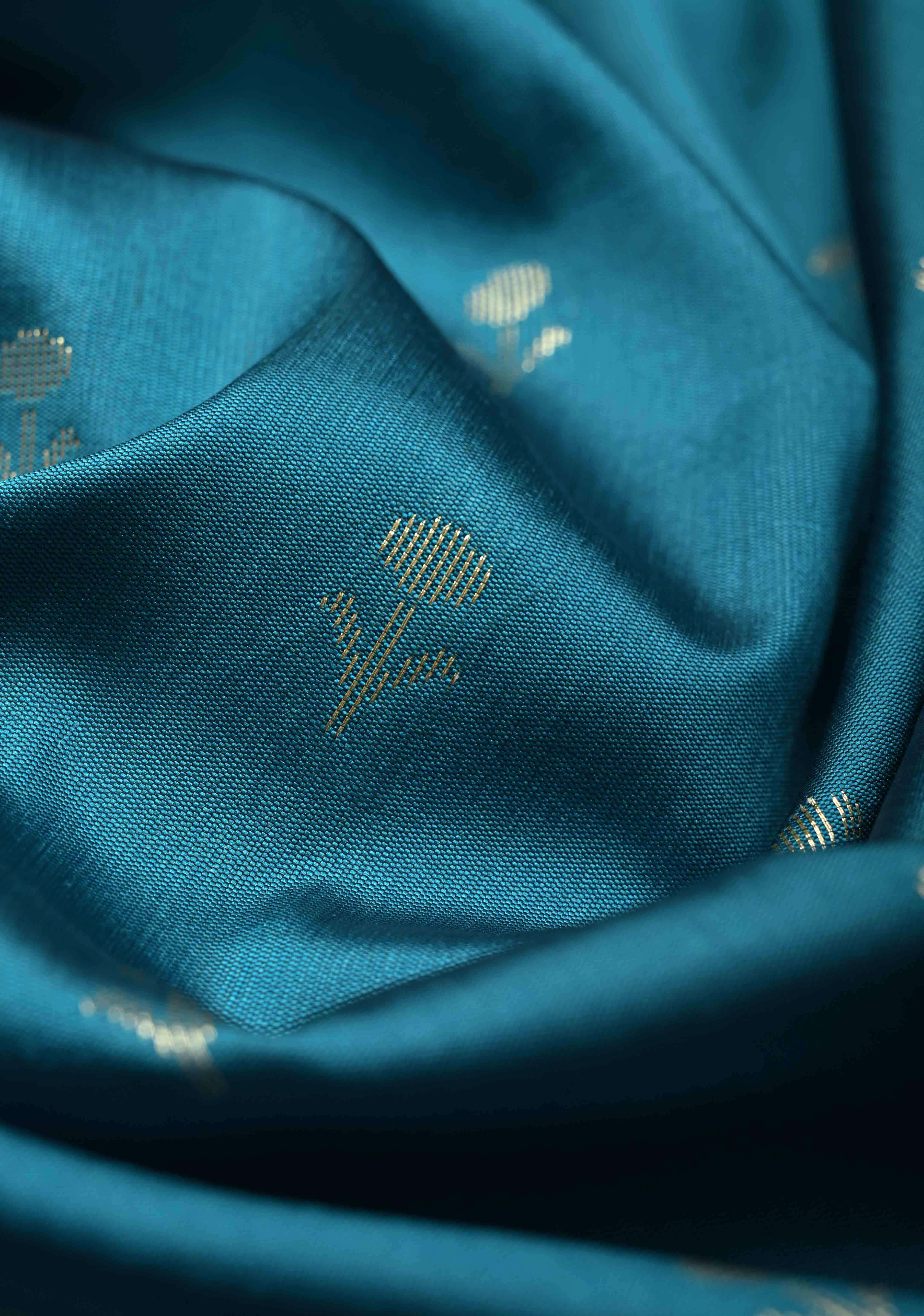 Peacock Blue Semi Silk Saree with Floral Buttis and Alfi Zari Border | Shobitam