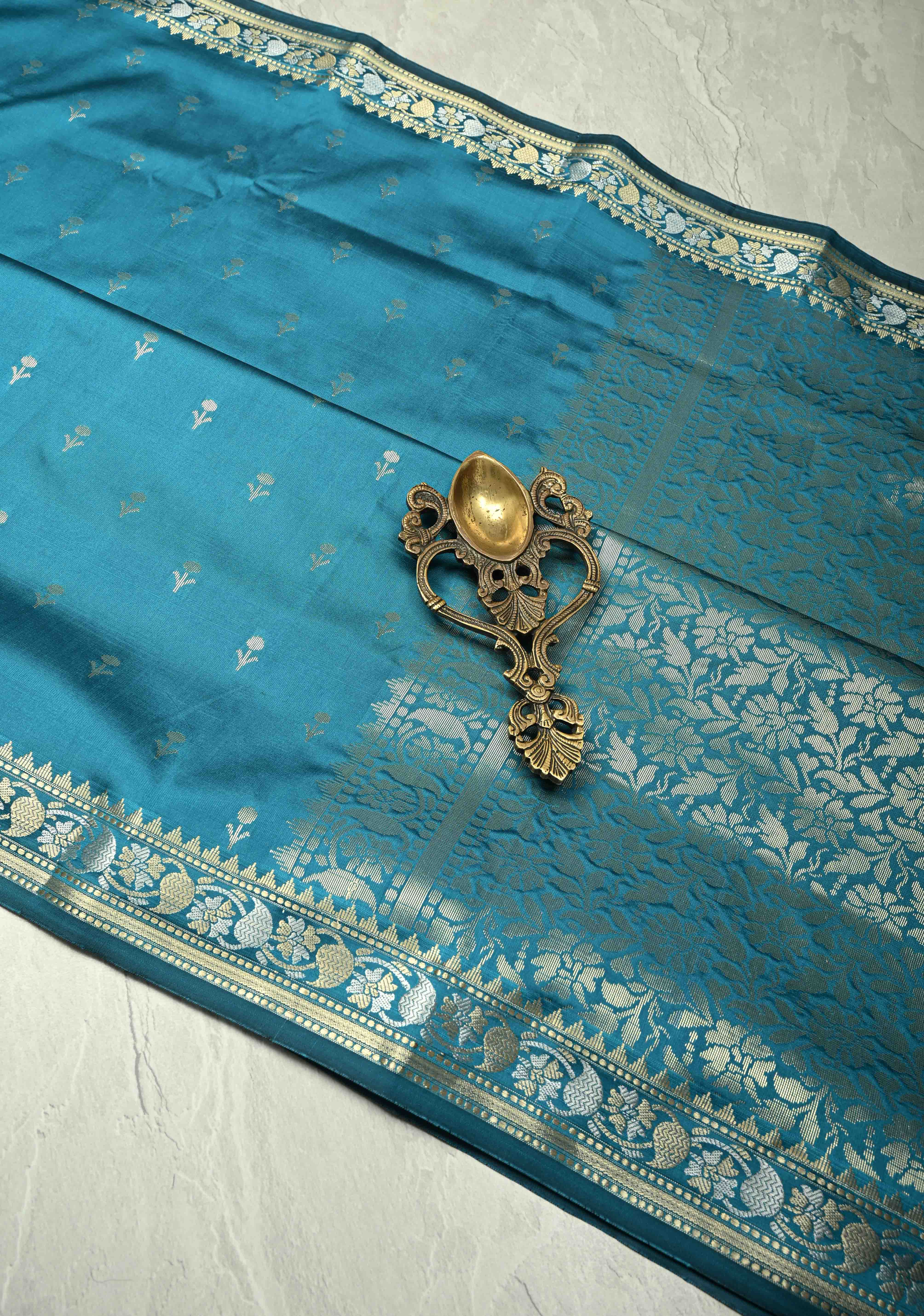Peacock Blue Semi Silk Saree with Floral Buttis and Alfi Zari Border