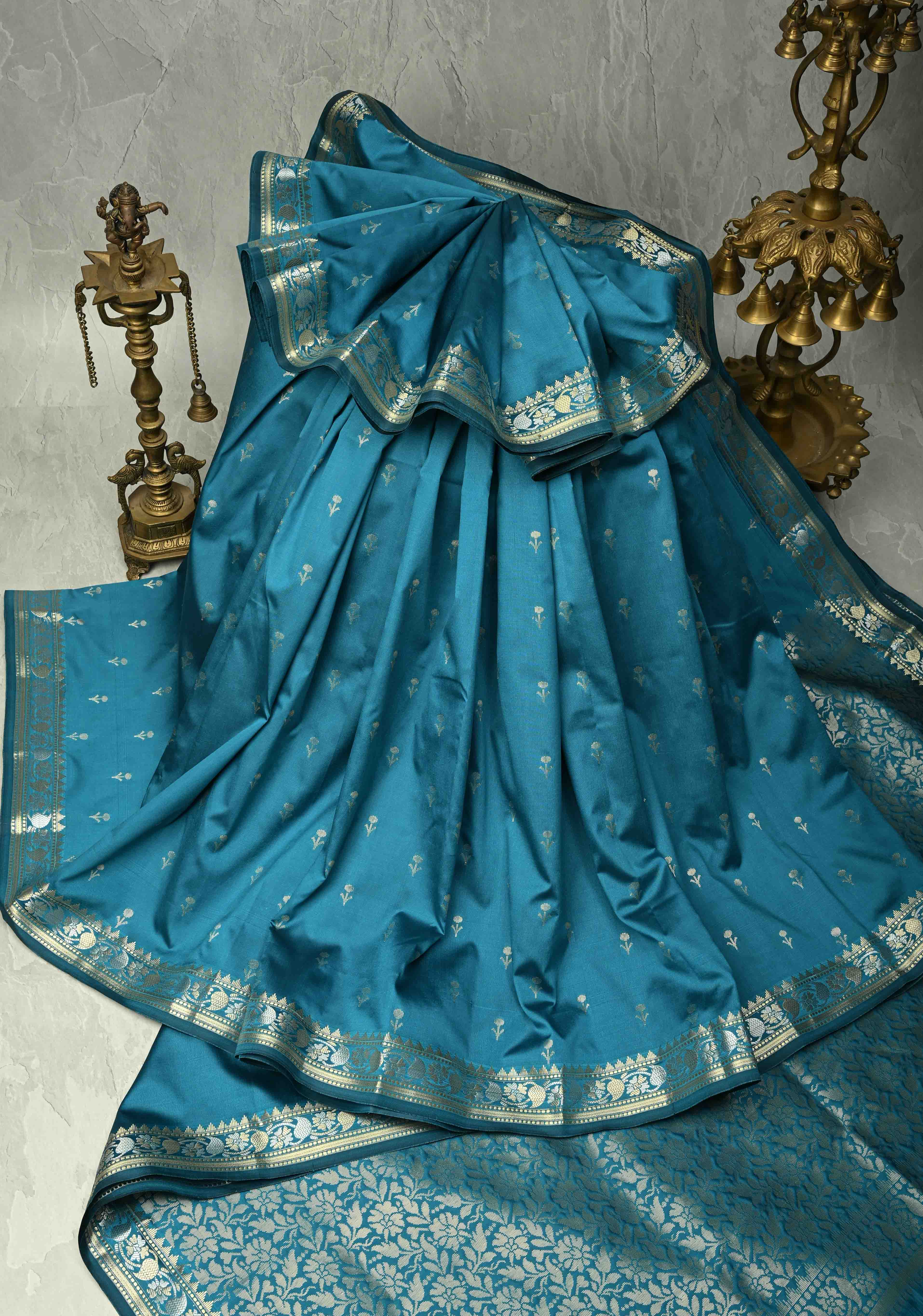 Peacock Blue Semi Silk Saree with Floral Buttis and Alfi Zari Border