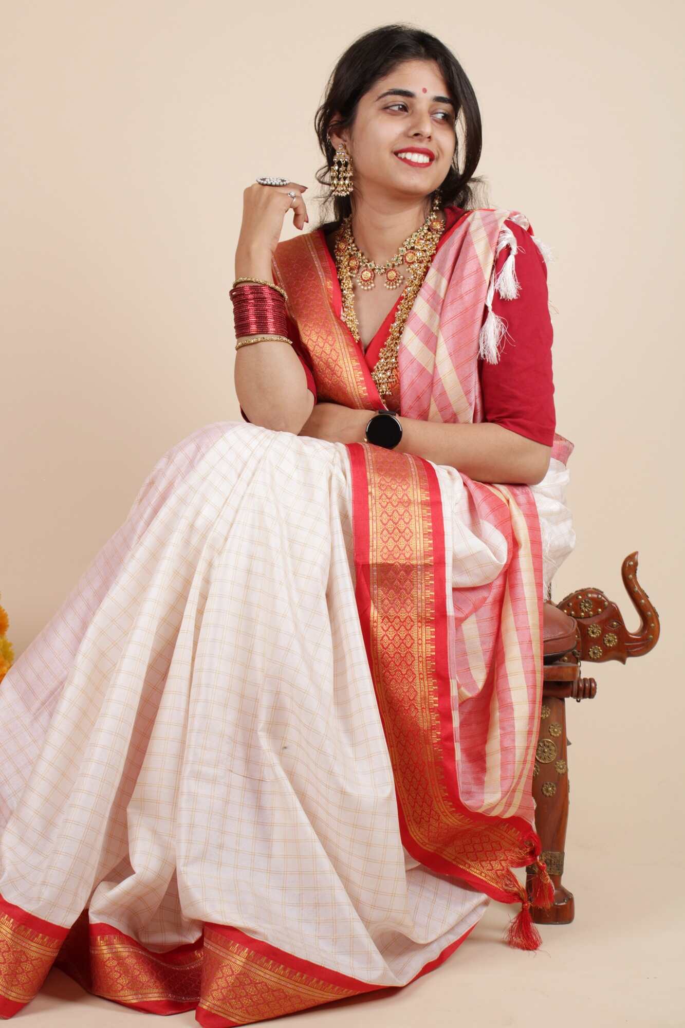 White and red silk Gadwal all over the check, pallu zari work wrap in minute saree